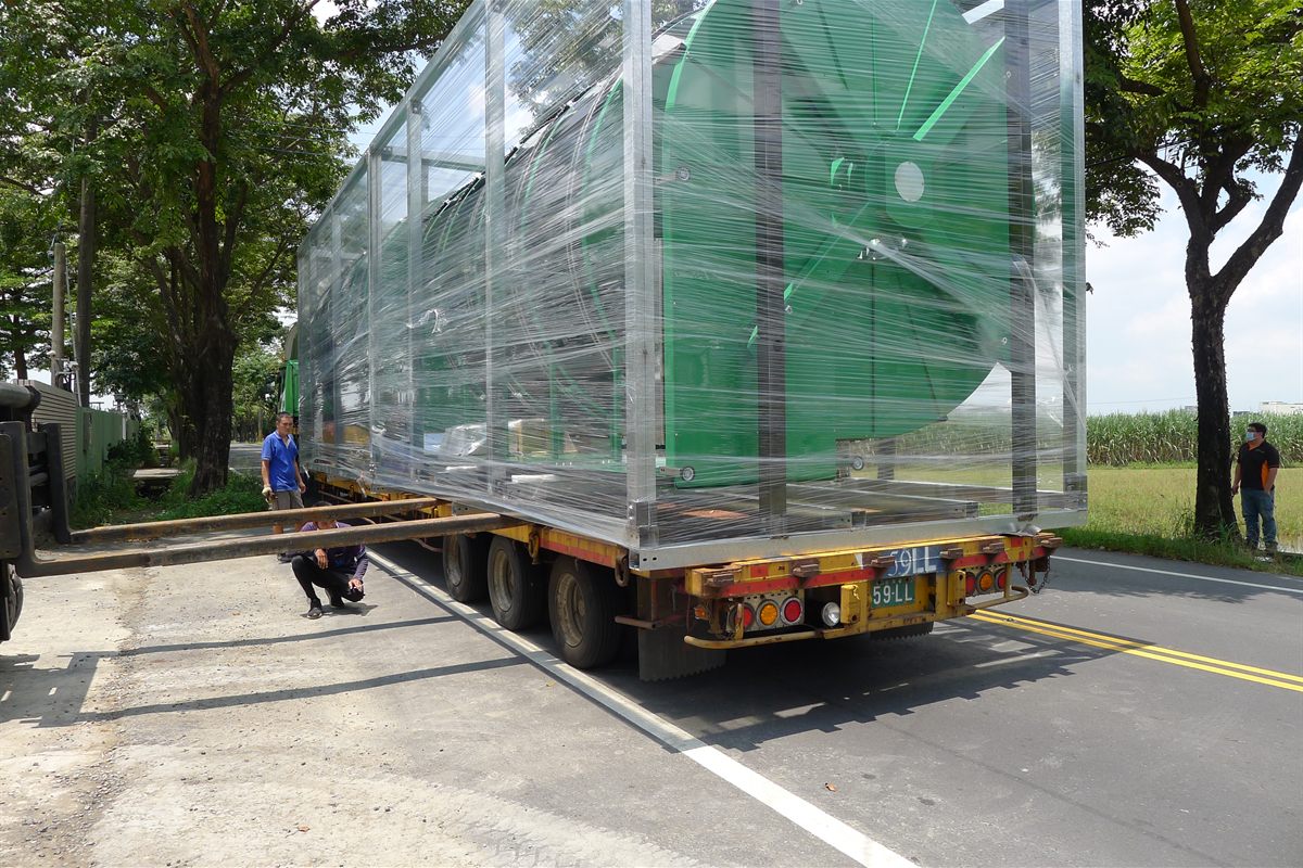 A NEXUS spiral conveyor being loaded onto a trailer for shipment.