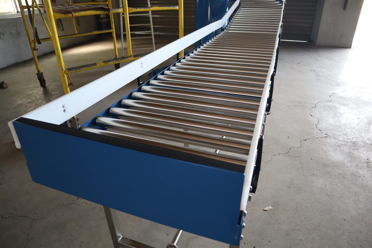 The unpowered rollers of a NEXUS gravity roller spiral conveyor.