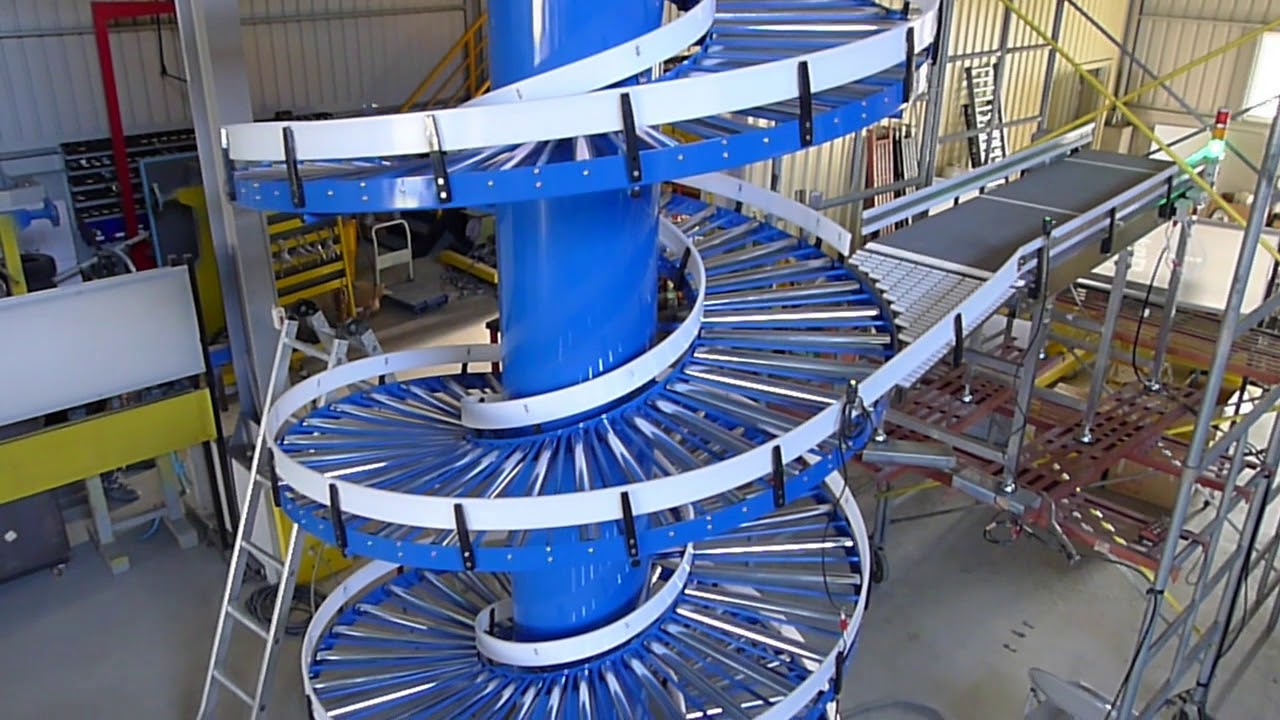 A blue gravity roller spiral conveyor with a straight roller conveyor joining it.