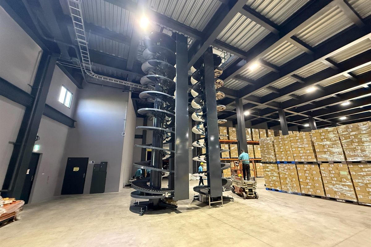 The infeed section of a spiral conveyor in a distribution centre.
